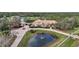 Aerial view of a luxury estate with a pond at 6200 Saddle Oak Trl, Sarasota, FL 34241