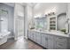 Elegant bathroom with double vanity and glass block shower at 6200 Saddle Oak Trl, Sarasota, FL 34241