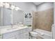 Clean bathroom with white vanity, bathtub, and tile shower at 6200 Saddle Oak Trl, Sarasota, FL 34241