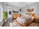 Bright bedroom with wood flooring, large windows, and built-in dresser at 6200 Saddle Oak Trl, Sarasota, FL 34241