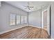 Light and airy bedroom with wood floors and en-suite bathroom at 6200 Saddle Oak Trl, Sarasota, FL 34241