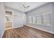 Well-lit bedroom with wood floors and en-suite bathroom at 6200 Saddle Oak Trl, Sarasota, FL 34241