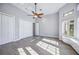 Spacious bedroom with double doors and large windows at 6200 Saddle Oak Trl, Sarasota, FL 34241