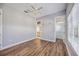 Spacious bedroom with wood floors and large window at 6200 Saddle Oak Trl, Sarasota, FL 34241
