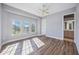 Bright bedroom with wood floors and large windows at 6200 Saddle Oak Trl, Sarasota, FL 34241
