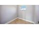 Small bedroom with tiled floor and window with blinds at 6200 Saddle Oak Trl, Sarasota, FL 34241