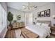 Bright bedroom with wood floors and a dresser at 6200 Saddle Oak Trl, Sarasota, FL 34241