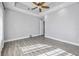 Empty bedroom with wood flooring and ample natural light at 6200 Saddle Oak Trl, Sarasota, FL 34241