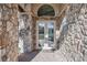 Elegant entry with double doors and stone accents at 6200 Saddle Oak Trl, Sarasota, FL 34241