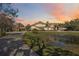 Grand estate with circular drive, pond, and manicured landscaping at 6200 Saddle Oak Trl, Sarasota, FL 34241