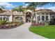 Luxury home with inviting entryway and lush landscaping at 6200 Saddle Oak Trl, Sarasota, FL 34241