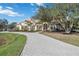 Stunning home showcasing a curved driveway and lush landscaping at 6200 Saddle Oak Trl, Sarasota, FL 34241
