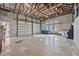 Large garage with high ceilings, multiple garage doors and storage at 6200 Saddle Oak Trl, Sarasota, FL 34241