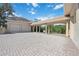 Three-car garage with covered walkway and paver driveway at 6200 Saddle Oak Trl, Sarasota, FL 34241