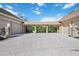 Three-car garage with covered walkway and paver driveway at 6200 Saddle Oak Trl, Sarasota, FL 34241
