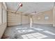 Three-car garage with high ceilings, windows, and additional storage at 6200 Saddle Oak Trl, Sarasota, FL 34241