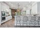 Spacious kitchen with white cabinetry, breakfast bar, and a view to the backyard at 6200 Saddle Oak Trl, Sarasota, FL 34241