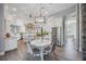 Island kitchen with white cabinetry, stainless steel appliances, and breakfast bar at 6200 Saddle Oak Trl, Sarasota, FL 34241