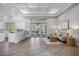 Open floor plan boasts a white kitchen island, Gathering room with cozy seating, and views to the pool at 6200 Saddle Oak Trl, Sarasota, FL 34241