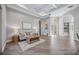 Spacious living room features wood-look floors and access to other rooms at 6200 Saddle Oak Trl, Sarasota, FL 34241