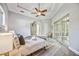 Main bedroom with wood-look floors and access to the pool area at 6200 Saddle Oak Trl, Sarasota, FL 34241
