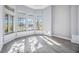 Sunlit office boasts a bay window, grey walls and wood-look tile floors at 6200 Saddle Oak Trl, Sarasota, FL 34241