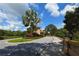 Gated community entrance with palm trees and landscaping at 6200 Saddle Oak Trl, Sarasota, FL 34241