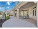 Outdoor patio with dining area, adjacent to the pool and spa at 6200 Saddle Oak Trl, Sarasota, FL 34241