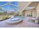 Relaxing pool and spa area with covered patio at 6200 Saddle Oak Trl, Sarasota, FL 34241