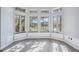 Bright sitting area with large windows and wood-look floors at 6200 Saddle Oak Trl, Sarasota, FL 34241