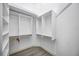 Bright walk-in closet with custom shelving and hanging rods at 6200 Saddle Oak Trl, Sarasota, FL 34241