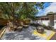 A relaxing backyard features a fire pit, comfortable seating, and ample entertaining space at 671 47Th St, Sarasota, FL 34234