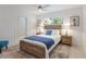 Cozy bedroom with neutral decor, a queen bed, and two side tables with lamps for reading at 671 47Th St, Sarasota, FL 34234