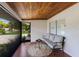 Inviting screened porch with a comfortable sofa and a view of the landscaped yard at 671 47Th St, Sarasota, FL 34234