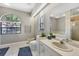 Bathroom with vanity, bathtub, and separate shower at 7242 Villa D Este Dr, Sarasota, FL 34238