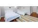 Guest bedroom with two twin beds and hardwood floors at 7242 Villa D Este Dr, Sarasota, FL 34238