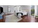 Main bedroom with king bed and large windows overlooking backyard at 7242 Villa D Este Dr, Sarasota, FL 34238