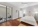 Bright bedroom with wood floors and patio access at 7242 Villa D Este Dr, Sarasota, FL 34238