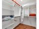Large walk-in closet with shelving and rods at 7242 Villa D Este Dr, Sarasota, FL 34238