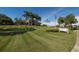 Community clubhouse with nicely landscaped grounds at 7242 Villa D Este Dr, Sarasota, FL 34238