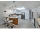 Updated kitchen with white cabinets, stainless steel appliances, and an island at 7242 Villa D Este Dr, Sarasota, FL 34238