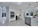 Modern kitchen with double oven, built-in desk, and island at 7242 Villa D Este Dr, Sarasota, FL 34238