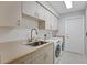 Laundry room with washer, dryer and sink at 7242 Villa D Este Dr, Sarasota, FL 34238