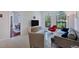 Comfortable living room with gray sofa and red accent chair, view into dining area at 7242 Villa D Este Dr, Sarasota, FL 34238