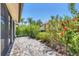 Private brick patio with lush landscaping and exterior access at 7242 Villa D Este Dr, Sarasota, FL 34238