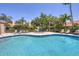 Relaxing community pool and spa area with surrounding lounge chairs at 7242 Villa D Este Dr, Sarasota, FL 34238
