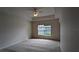 Spacious bedroom with carpeted floor, ceiling fan, and window at 7307 Fountain Palm Cir # 7-102, Bradenton, FL 34203