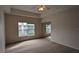 Bright bedroom with carpeted floor, window, and ceiling fan at 7307 Fountain Palm Cir # 7-102, Bradenton, FL 34203