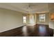 Living room with dark laminate floors, neutral walls, and entryway at 7307 Fountain Palm Cir # 7-102, Bradenton, FL 34203