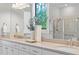 Bright bathroom features double vanity, stained glass window, and ample counter space at 788 Sigsbee Loop, Sarasota, FL 34240